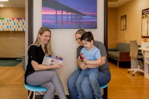 Speech therapist meeting with a parent and child at Ocean Beach Speech